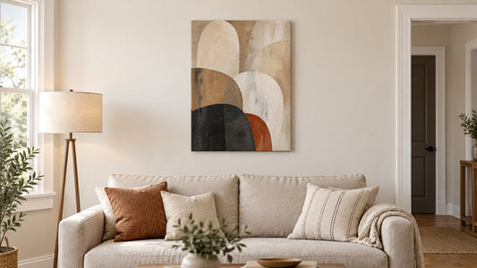 Canvas wall art arranged above a sofa in a compact living room
