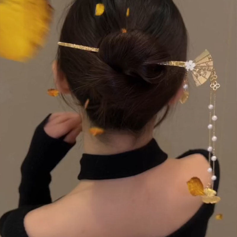 Horquilla con borlas y forma de abanico