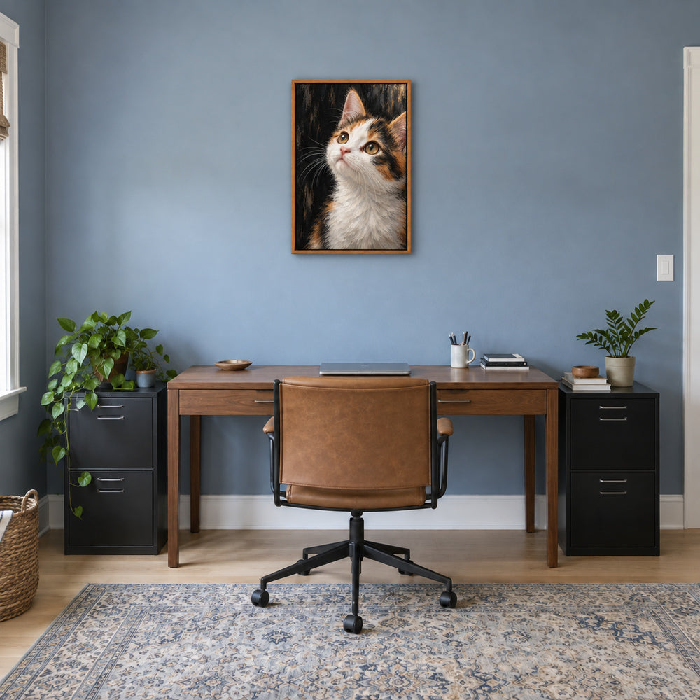 calico kitten oil-painting-style portrait in brown frame room scene